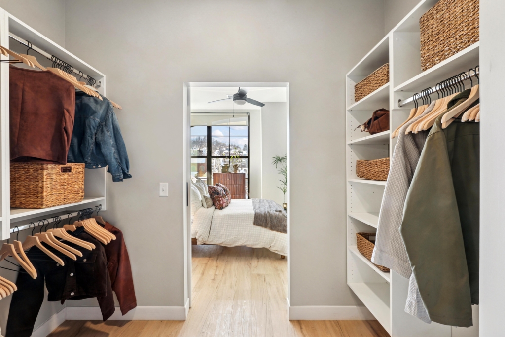 Closet with shelving and clothes