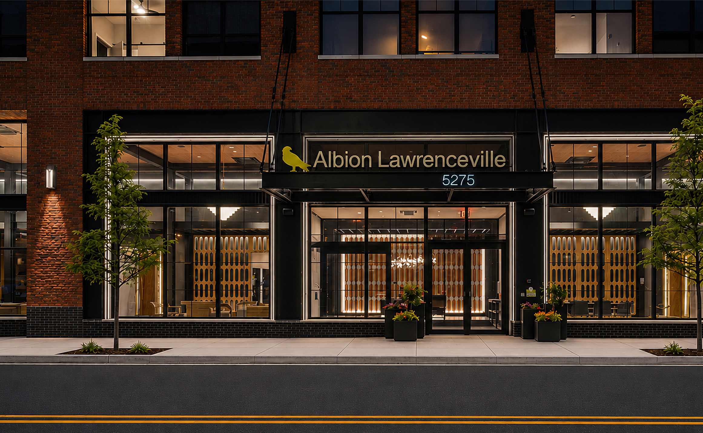 exterior entrance to the building with building name on awning