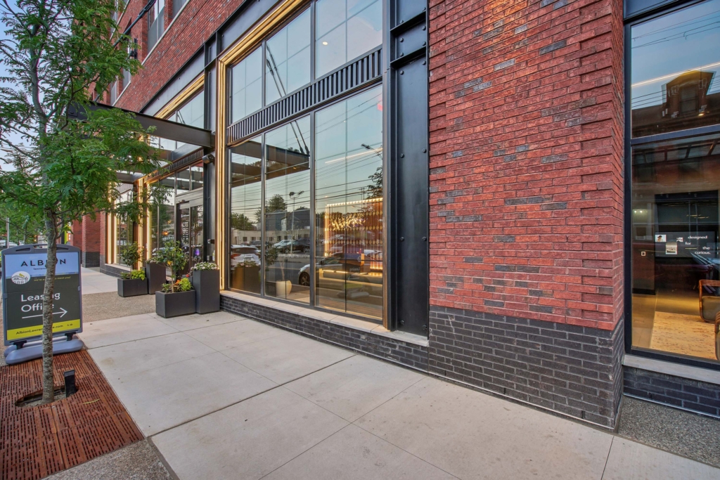 Sidewalk with entrance to community